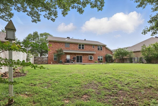 11 Crystal Mountain Ln, Maumelle, AR 72113 - back of house with brick siding and a gate