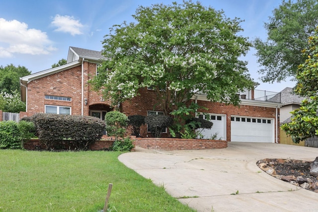 11 Crystal Mountain Ln, Maumelle, AR 72113 - obstructed view of property featuring brick siding, driveway, a front yard, and an attached garage