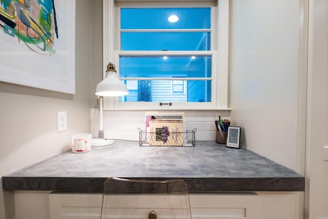 6709 Waverly Dr, Little Rock, AR 72207 - kitchen with white cabinetry and decorative backsplash