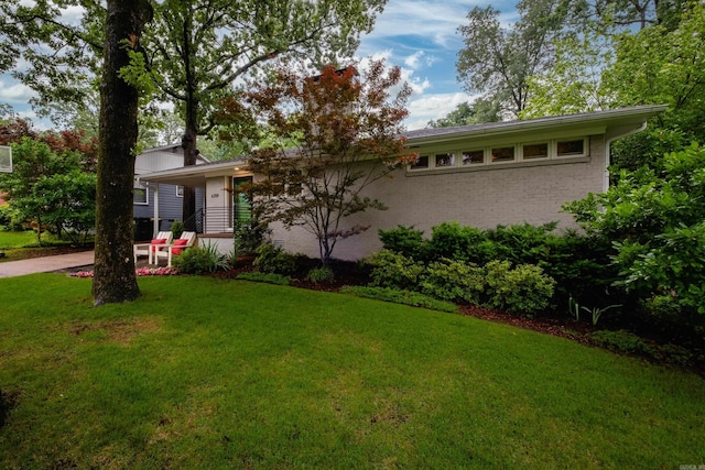 6709 Waverly Dr, Little Rock, AR 72207 - view of front facade with a front lawn and brick siding