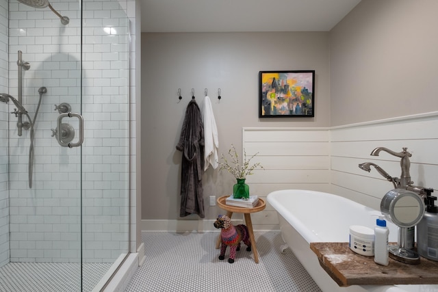 6709 Waverly Dr, Little Rock, AR 72207 - full bathroom featuring a stall shower, a freestanding tub, and tile patterned floors