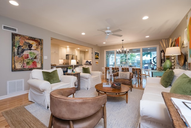 6709 Waverly Dr, Little Rock, AR 72207 - living area featuring a chandelier, ceiling fan, light wood-type flooring, recessed lighting, and baseboards