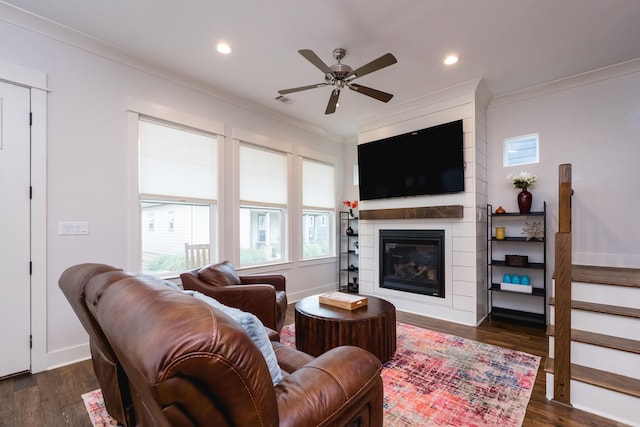 313 Parker St, North Little Rock, AR 72114 - living area with ornamental molding, ceiling fan, recessed lighting, a large fireplace, and dark wood finished floors