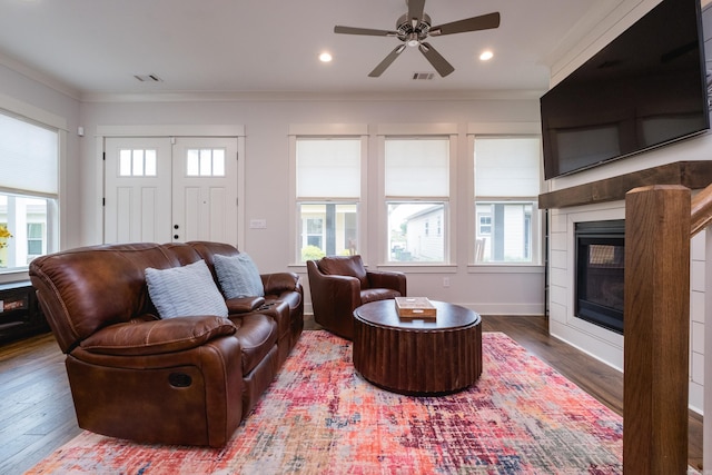 313 Parker St, North Little Rock, AR 72114 - living room with ornamental molding, a fireplace, plenty of natural light, wood finished floors, and recessed lighting