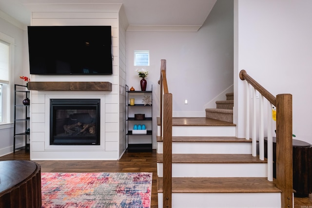 313 Parker St, North Little Rock, AR 72114 - stairs with wood finished floors, a large fireplace, and baseboards
