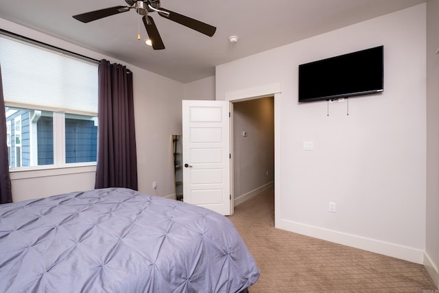 313 Parker St, North Little Rock, AR 72114 - bedroom featuring carpet, baseboards, and ceiling fan