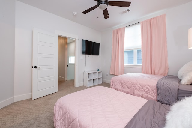 313 Parker St, North Little Rock, AR 72114 - carpeted bedroom featuring baseboards and ceiling fan
