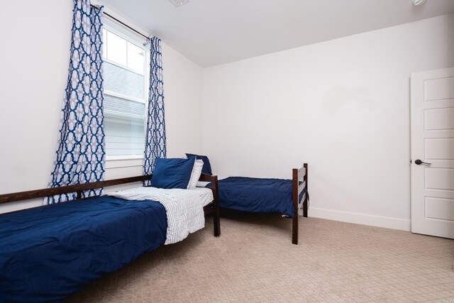 313 Parker St, North Little Rock, AR 72114 - bedroom featuring carpet and baseboards