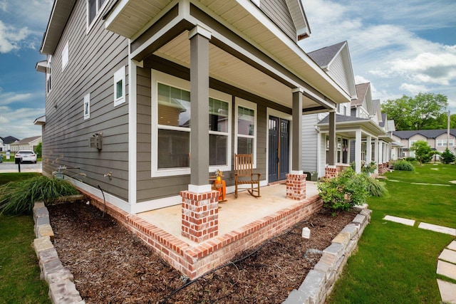 313 Parker St, North Little Rock, AR 72114 - property entrance with a porch and a yard