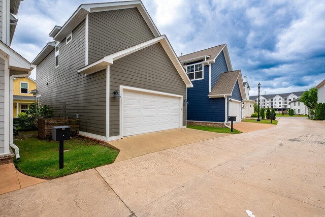 313 Parker St, North Little Rock, AR 72114 - view of home's exterior featuring a garage and a residential view