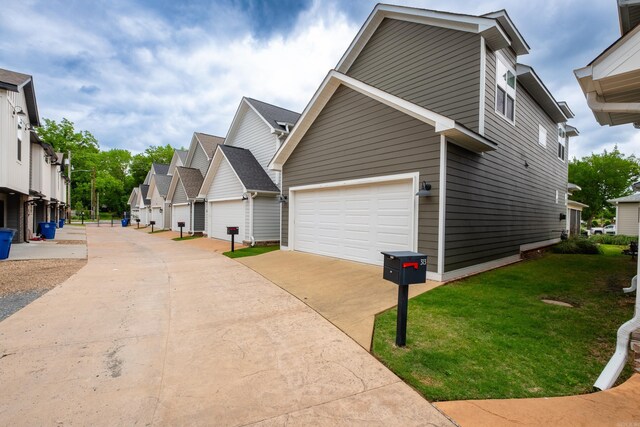313 Parker St, North Little Rock, AR 72114 - view of home's exterior featuring a residential view, a yard, and driveway