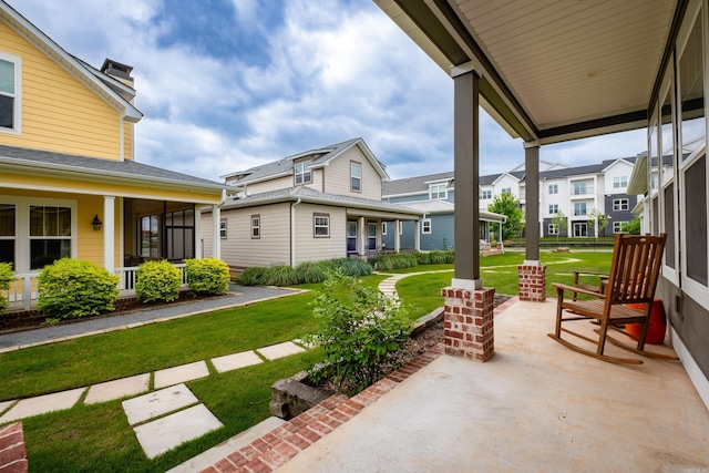 313 Parker St, North Little Rock, AR 72114 - covered porch with a lawn and a residential view