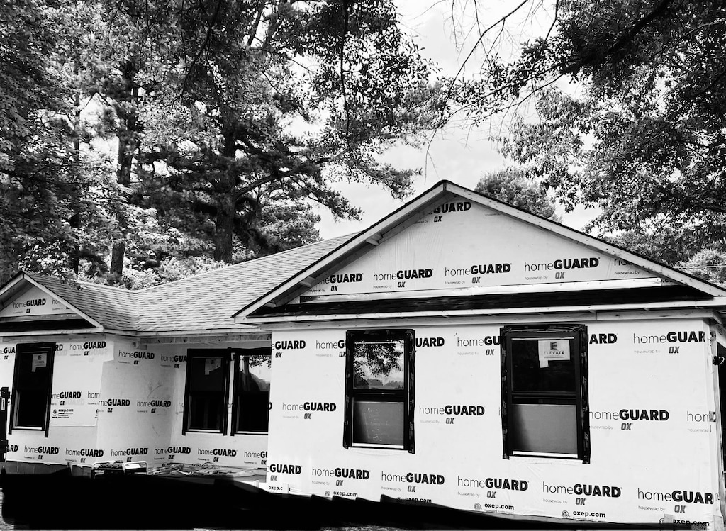 property under construction featuring roof with shingles