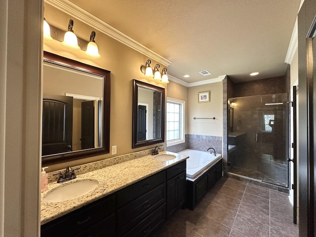 full bath featuring ornamental molding, a bath, tile patterned flooring, a stall shower, and double vanity