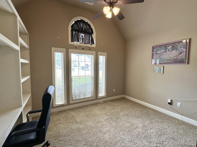 unfurnished office with ceiling fan, carpet floors, lofted ceiling, and baseboards