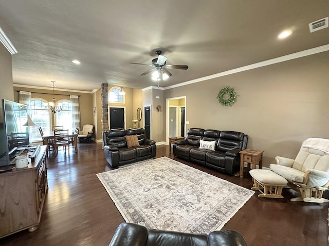 living room with ornamental molding, dark wood-type flooring, a ceiling fan, baseboards, and a chandelier