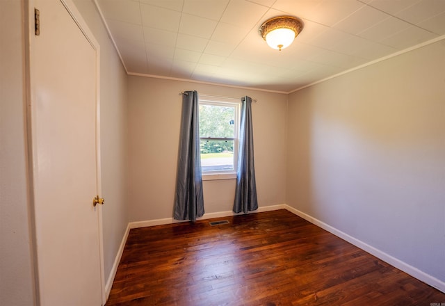 10111 Kling Rd, Mabelvale, AR 72103 - empty room with dark wood-style floors, ornamental molding, and baseboards