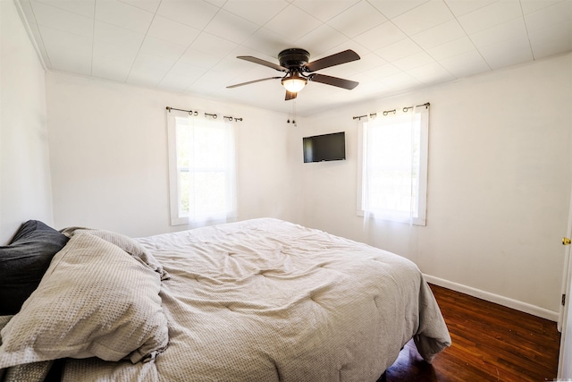 10111 Kling Rd, Mabelvale, AR 72103 - bedroom featuring dark wood-style floors, baseboards, and a ceiling fan
