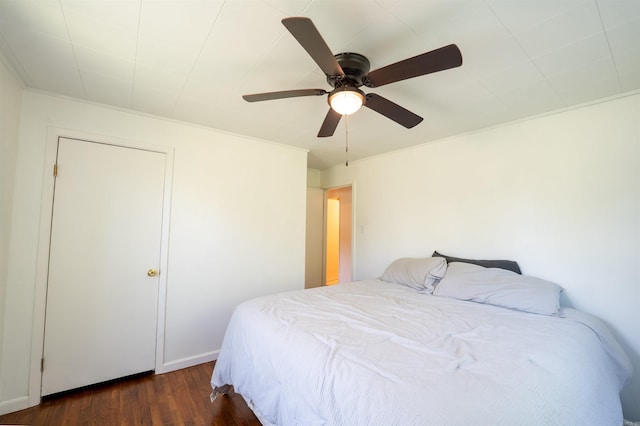 10111 Kling Rd, Mabelvale, AR 72103 - bedroom with dark wood-style flooring and a ceiling fan