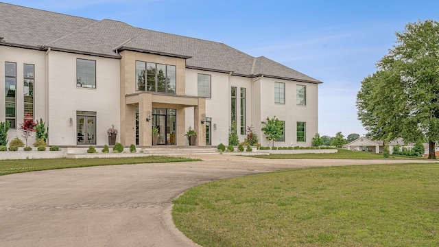 3307 Pruetts Chapel Rd, Paragould, AR 72450 - view of front of home featuring a front lawn and curved driveway