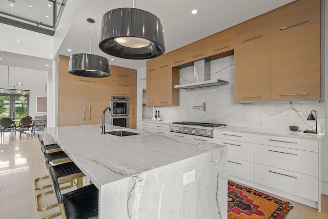 3307 Pruetts Chapel Rd, Paragould, AR 72450 - kitchen featuring modern cabinets, wall chimney range hood, stainless steel appliances, and recessed lighting