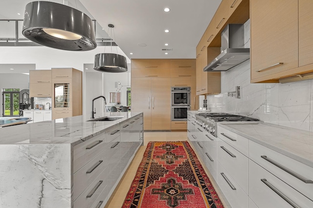 3307 Pruetts Chapel Rd, Paragould, AR 72450 - kitchen with modern cabinets, wall chimney exhaust hood, a sink, stainless steel appliances, and backsplash