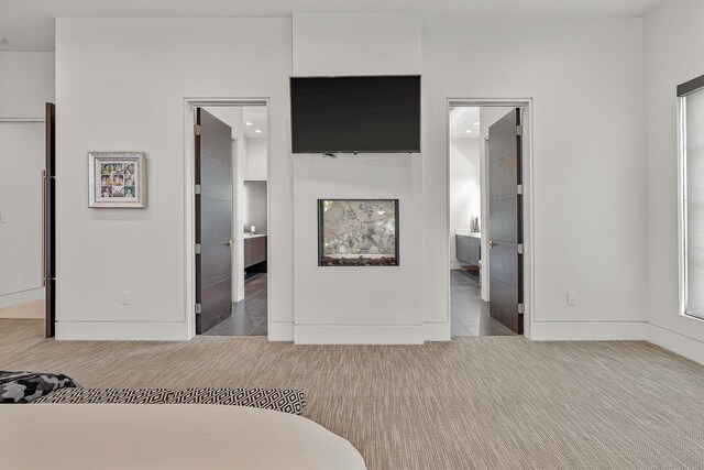 3307 Pruetts Chapel Rd, Paragould, AR 72450 - carpeted bedroom with ensuite bathroom and baseboards