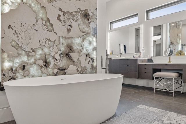 3307 Pruetts Chapel Rd, Paragould, AR 72450 - full bath featuring vanity, a freestanding tub, and a towering ceiling