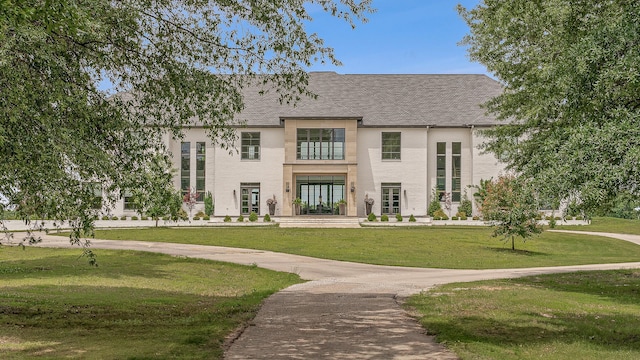3307 Pruetts Chapel Rd, Paragould, AR 72450 - rear view of property featuring a lawn