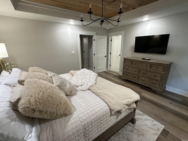 2529 Brandy Dr, Heber Springs, AR 72543 - bedroom featuring wood ceiling, wood finished floors, baseboards, a chandelier, and a raised ceiling