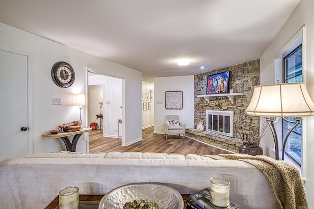 30 Segovia Dr, Hot Springs Village, AR 71909 - living area featuring wood finished floors, a fireplace, and baseboards