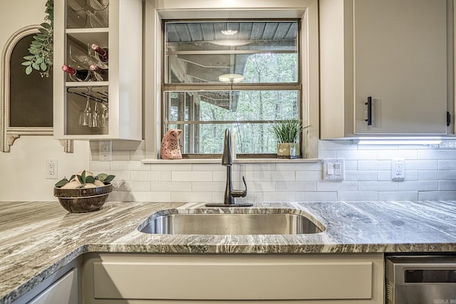 30 Segovia Dr, Hot Springs Village, AR 71909 - kitchen featuring a sink, light stone counters, and backsplash