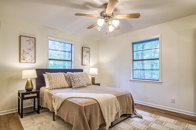 30 Segovia Dr, Hot Springs Village, AR 71909 - bedroom with wood finished floors, baseboards, and ceiling fan