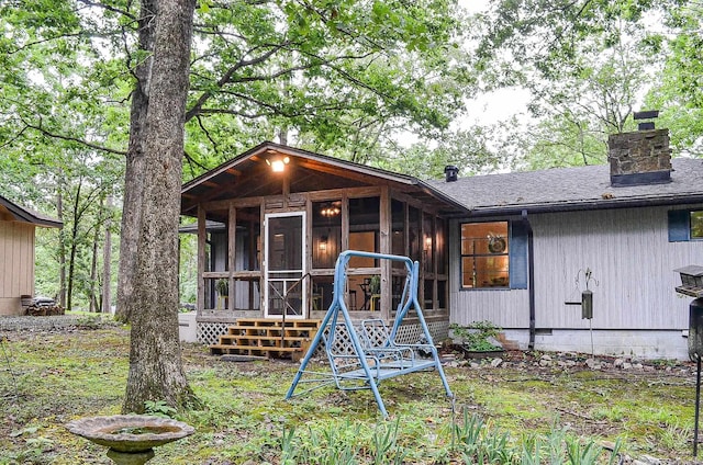 30 Segovia Dr, Hot Springs Village, AR 71909 - view of front facade featuring a sunroom and a chimney