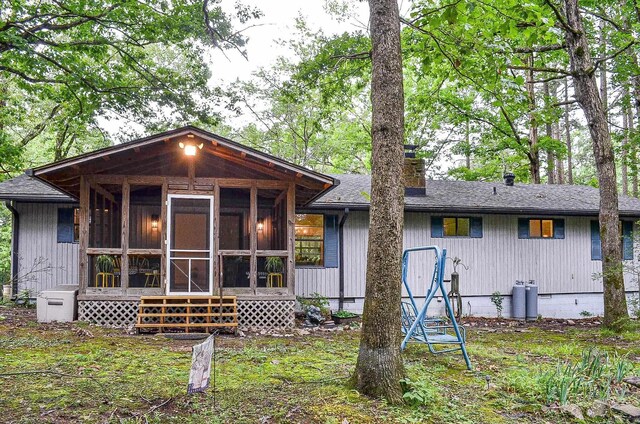 30 Segovia Dr, Hot Springs Village, AR 71909 - rear view of house featuring a sunroom, a chimney, roof with shingles, and crawl space