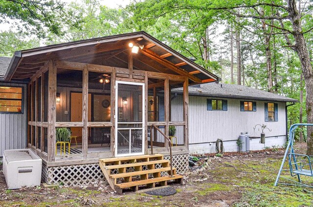 30 Segovia Dr, Hot Springs Village, AR 71909 - back of house with a sunroom, roof with shingles, and crawl space