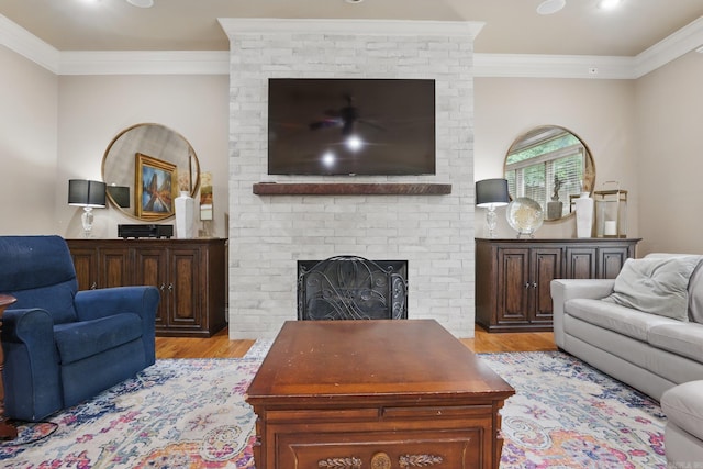 53 Maisons, Little Rock, AR 72223 - living area featuring light wood finished floors, ornamental molding, a fireplace, and recessed lighting