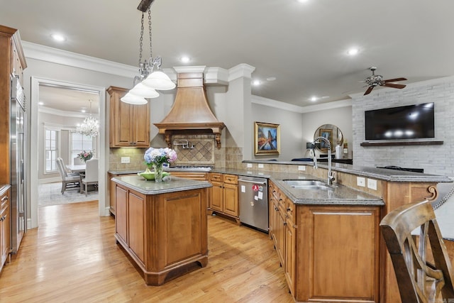 53 Maisons, Little Rock, AR 72223 - kitchen featuring appliances with stainless steel finishes, a peninsula, a sink, a center island, and backsplash