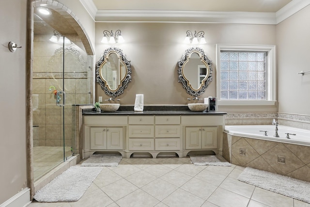 53 Maisons, Little Rock, AR 72223 - full bathroom featuring double vanity, crown molding, a stall shower, a garden tub, and tile patterned floors