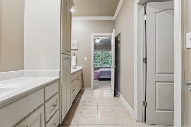 53 Maisons, Little Rock, AR 72223 - ensuite bathroom with vanity, crown molding, ceiling fan, tile patterned floors, and baseboards