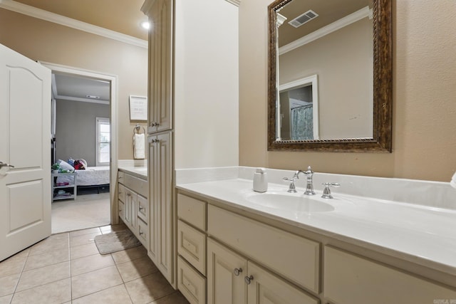 53 Maisons, Little Rock, AR 72223 - ensuite bathroom featuring ornamental molding, vanity, and tile patterned flooring
