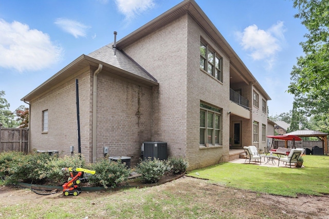 53 Maisons, Little Rock, AR 72223 - back of house featuring a patio area, a gazebo, brick siding, and central AC