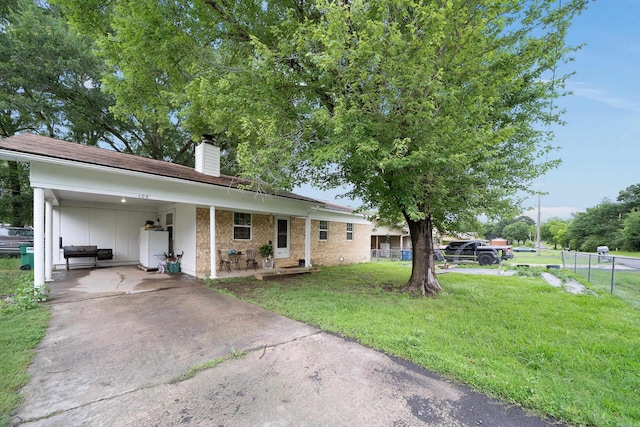 105 Rhode Island St, Beebe, AR 72012 - ranch-style home featuring a chimney, an attached carport, driveway, brick siding, and board and batten siding