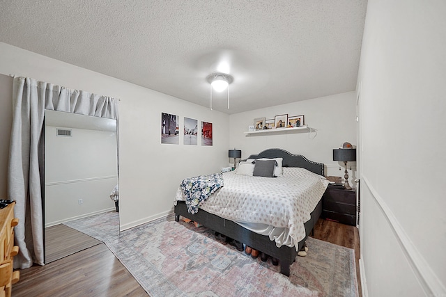 105 Rhode Island St, Beebe, AR 72012 - bedroom with wood finished floors and a textured ceiling