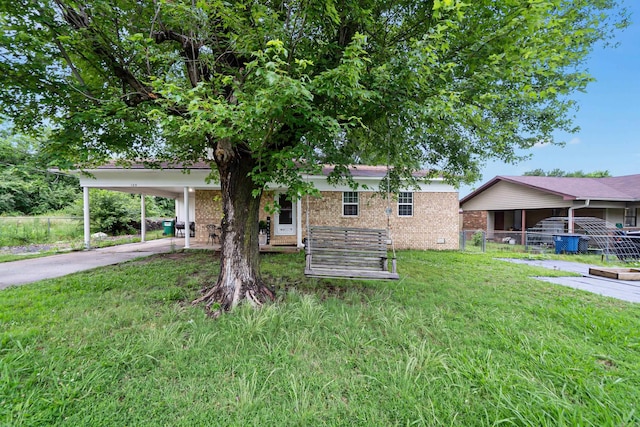 105 Rhode Island St, Beebe, AR 72012 - view of front of house featuring brick siding, driveway, and a carport