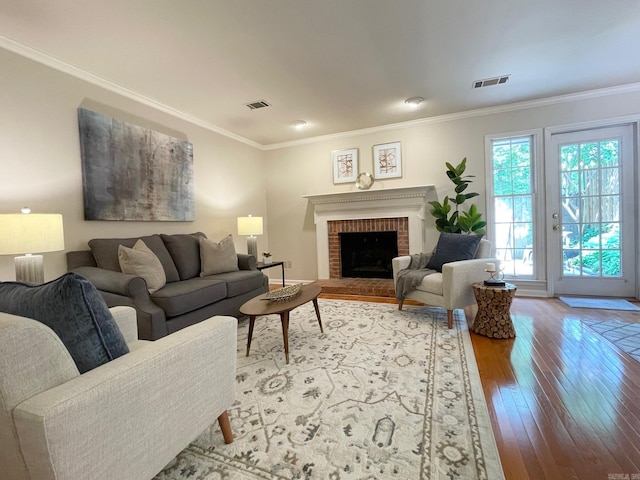 2200 Andover Ct Unit 403, Little Rock, AR 72227 - living room with light wood-type flooring, crown molding, and a brick fireplace