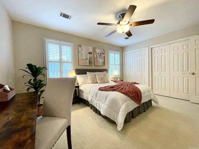 2200 Andover Ct Unit 403, Little Rock, AR 72227 - carpeted bedroom with two closets and a ceiling fan