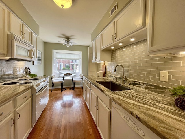 2200 Andover Ct Unit 403, Little Rock, AR 72227 - kitchen featuring white appliances, a sink, decorative backsplash, ceiling fan, and light stone countertops