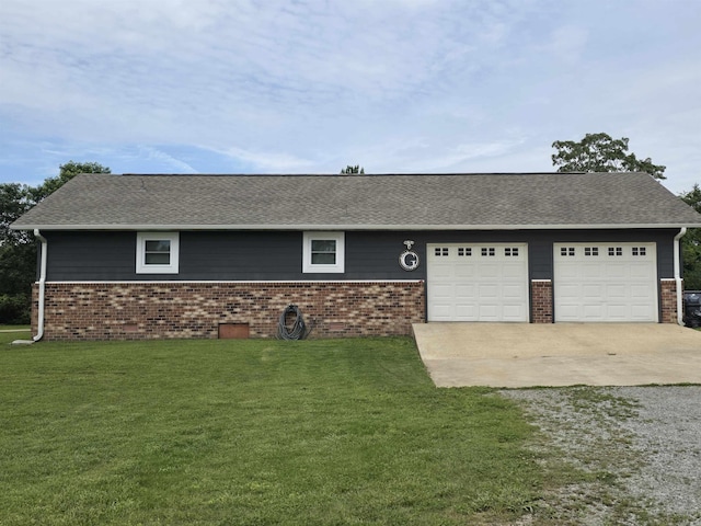 2373 W Rd, Mount Pleasant, AR 72561 - view of front facade with concrete driveway, brick siding, an attached garage, and a front yard