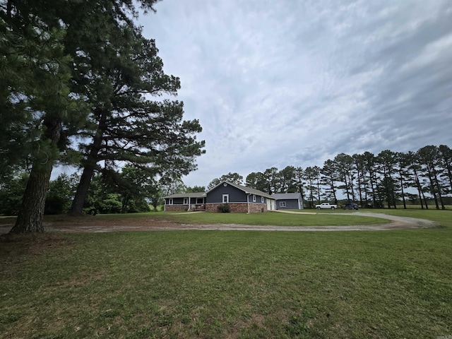 2373 W Rd, Mount Pleasant, AR 72561 - view of front facade featuring driveway, a front yard, and a garage